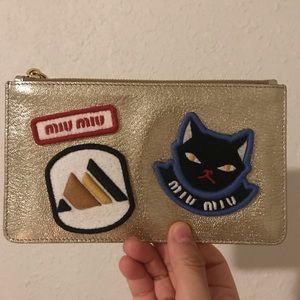 Miu Miu gold pouch